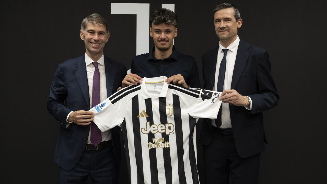 TURIN, ITALY - AUGUST 1: New signing J Kerim Alajbegovic poses whit Frederic Massara and Marco Ottolini at Juventus headquarters on August 1, 2026 in Turin, Italy.