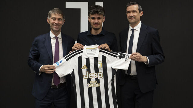 TURIN, ITALY - AUGUST 1: New signing J Kerim Alajbegovic poses whit Frederic Massara and Marco Ottolini at Juventus headquarters on August 1, 2026 in Turin, Italy.