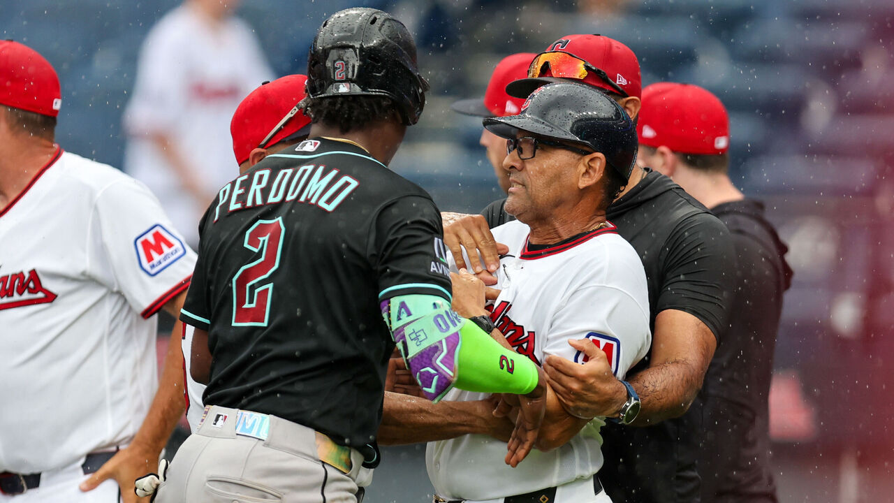CLEVELAND, OH - AUGUST 02: Arizona Diamondbacks shortstop Geraldo Perdomo (2) separates Cleveland Guardians third base and infield coach Rouglas Odor (53) from the pack as the benched cleared during the sixth inning of the Major League Baseball interleague game between the Arizona Diamondbacks and Cleveland Guardians on August 2, 2026, at Progressive Field in Cleveland, OH.