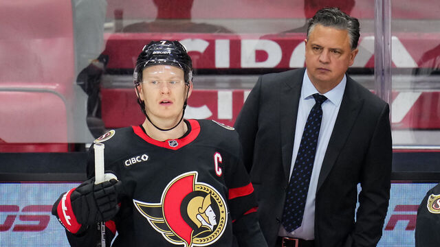 OTTAWA, CANADA - APRIL 5: Brady Tkachuk #7 and Travis Green of the Ottawa Senators look on from the bench during an NHL game against the Carolina Hurricanes on April 5, 2026 at Canadian Tire Centre in Ottawa, Ontario, Canada.