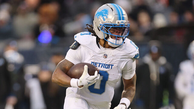 CHICAGO, ILLINOIS - JANUARY 04: Jahmyr Gibbs #0 of the Detroit Lions runs with the ball against the Chicago Bears at Soldier Field on January 04, 2026 in Chicago, Illinois.