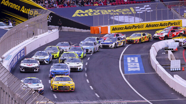 Los Angeles, CA - February 06: NASCAR racers circle the quarter-mile track during the Busch Light Clash At The Coliseum, a NASCAR exhibition race at the historic LA Memorial Coliseum in Los Angeles Sunday, Feb. 6, 2022. Joey Logano, #22, went on to win the race. The season-opening Clash exhibition race gets a taste of West Coast flavor in 2022, marking a historic first visit to the tradition-rich Los Angeles Memorial Coliseum. The event was contested around a quarter-mile asphalt oval that was built around the facilitys football field. The Los Angeles event marks the first time the preseason Clash is held outside of Daytona International Speedway since its inception in 1979, and gives the sport its first competitive look at the Next Gen car on Feb. 6 in a non-points event, including a pre-race concert by Pit Bull and Ice Cube. (Allen J. Schaben / Los Angeles Times via Getty Images)
