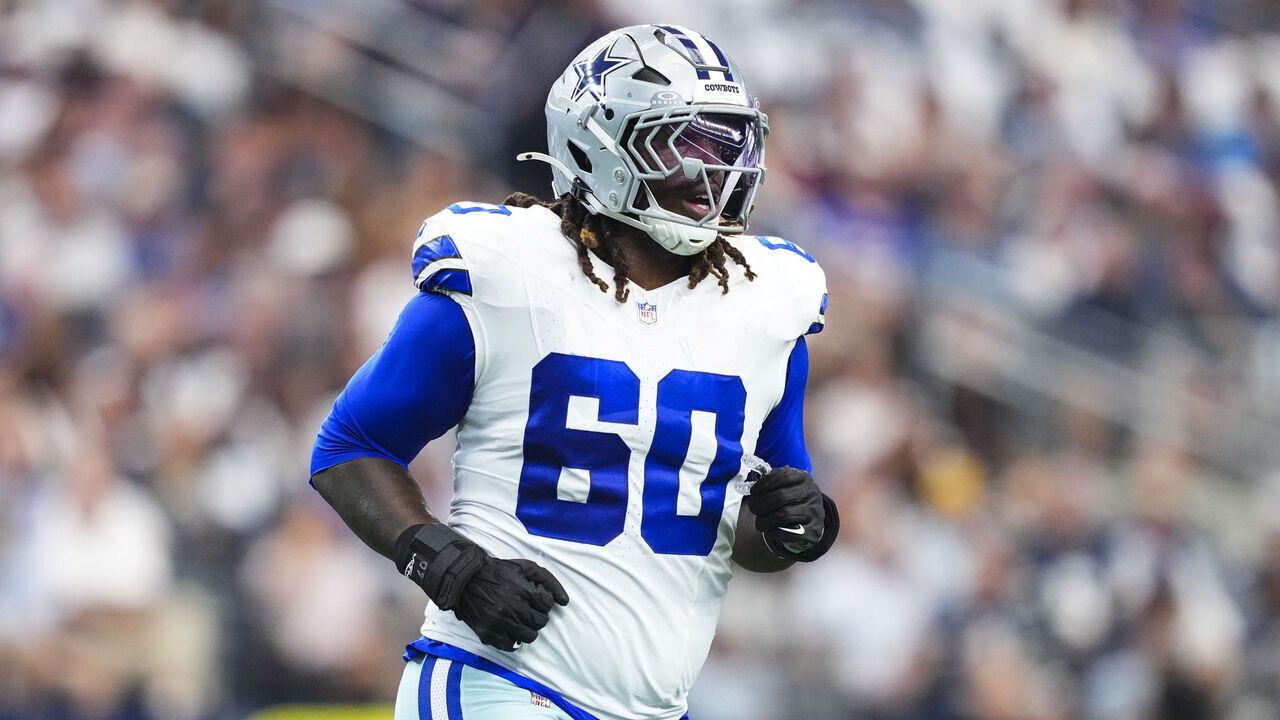 ARLINGTON, TX - SEPTEMBER 14: Tyler Guyton #60 of the Dallas Cowboys runs across the field during an NFL football game against the New York Giants at AT&T Field on September 14, 2025 in Arlington, Texas.