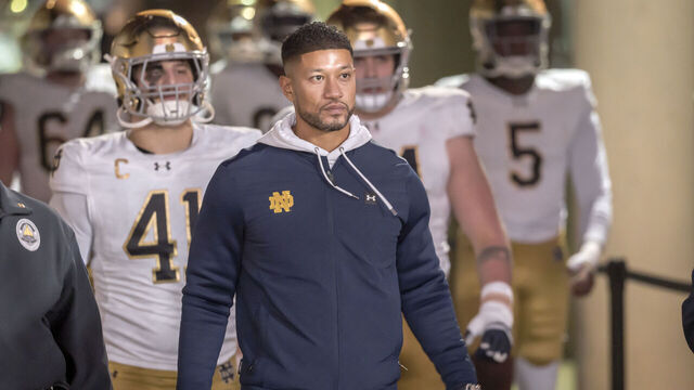 PALO ALTO, CA - NOVEMBER 29: Head Coach Marcus Freeman of the Notre Dame Fighting Irish leads his team into the stadium to start the second half of a college football game against the Stanford Cardinal on November 29, 2025 at Stanford Stadium in Palo Alto, California.