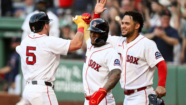 BOSTON, MASSACHUSETTS - AUGUST 04: Caleb Durbin #5 of the Boston Red Sox celebrates with Ceddanne Rafaela #3 and Willson Contreras #40 after hitting a grand slam home run against the Chicago White Sox during the first inning at Fenway Park on August 04, 2026 in Boston, Massachusetts.