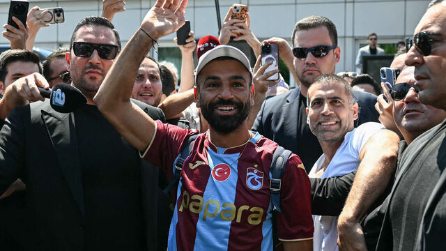 Egyptian forward Mohamed Salah gestures as he arrives at Istanbul Ataturk Airport to complete his transfer to Turkish football club Trabzonspor in Istanbul on August 5, 2026.