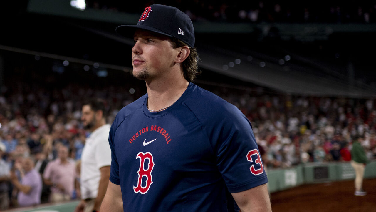 BOSTON, MASSACHUSETTS - AUGUST 4: Adley Rutschman #31 of the Boston Red Sox walks off the field after a win against the Chicago White Sox on August 4, 2026 at Fenway Park in Boston, Massachusetts.
