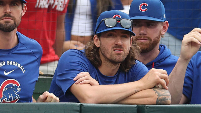 CHICAGO, ILLINOIS - AUGUST 05: Clay Holmes and Kevin Gausman of the Chicago Cubs look on against the Los Angeles Dodgers at Wrigley Field on August 05, 2026 in Chicago, Illinois.