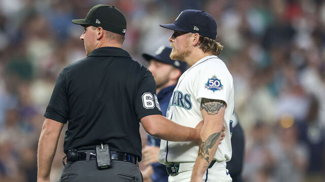SEATTLE, WASHINGTON - AUGUST 05: Gabe Speier #55 of the Seattle Mariners is held back after hitting a batter during the eighth inning against the Detroit Tigers at T-Mobile Park on August 05, 2026 in Seattle, Washington.