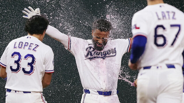 ARLINGTON, TX - AUGUST 04: Ezequiel Duran #20 of the Texas Rangers celebrates with teammates after hitting a walk-off ground-rule double in the ninth inning during the game between the San Francisco Giants and the Texas Rangers at Globe Life Field on Tuesday, August 4, 2026 in Arlington, Texas.