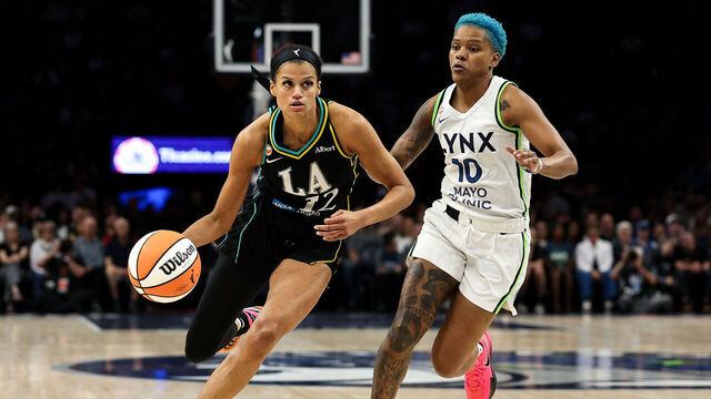 MINNEAPOLIS, MINNESOTA - AUGUST 6: Rae Burrell #12 of the Los Angeles Sparks works around Courtney Williams #10 of the Minnesota Lynx during the first half at Target Center on August 6, 2026 in Minneapolis, Minnesota.