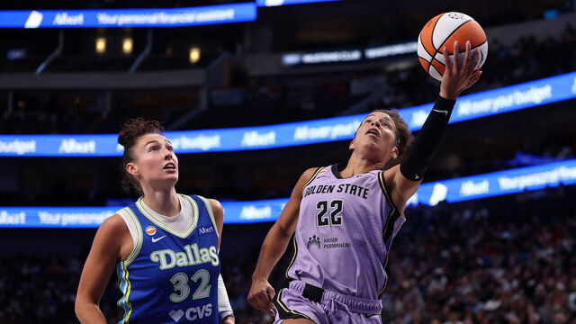 DALLAS, TEXAS - AUGUST 07: Veronica Burton #22 of the Golden State Valkyries drives to the basket against Jessica Shepard #32 of the Dallas Wings during the first half at American Airlines Center on August 07, 2026 in Dallas, Texas. NOTE TO USER: User expressly acknowledges and agrees that, by downloading and or using this photograph, User is consenting to the terms and conditions of the GettyImages License Agreement.