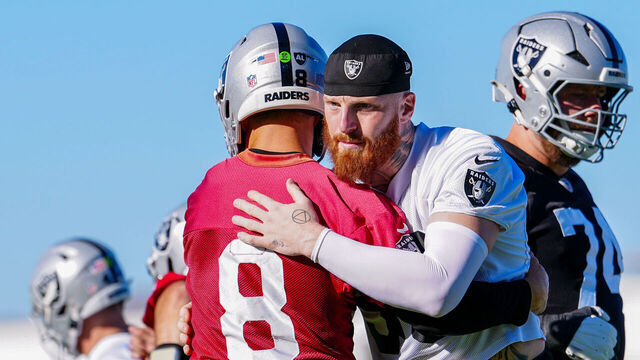 HENDERSON, NEVADA - JUNE 09: Maxx Crosby #98 and Kirk Cousins #8 of the Las Vegas Raiders embrace during mandatory minicamp at the Las Vegas Raiders Headquarters/Intermountain Health Performance Center on June 09, 2026 in Henderson, Nevada.