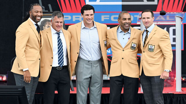 CANTON, OHIO - AUGUST 08: (L-R) Larry Fitzgerald, Adam Vinatieri, Luke Kuechly, Roger Craig and Drew Brees pose for photos during the 2026 Pro Football Hall of Fame Enshrinement Ceremony at Tom Benson Hall Of Fame Stadium on August 08, 2026 in Canton, Ohio.