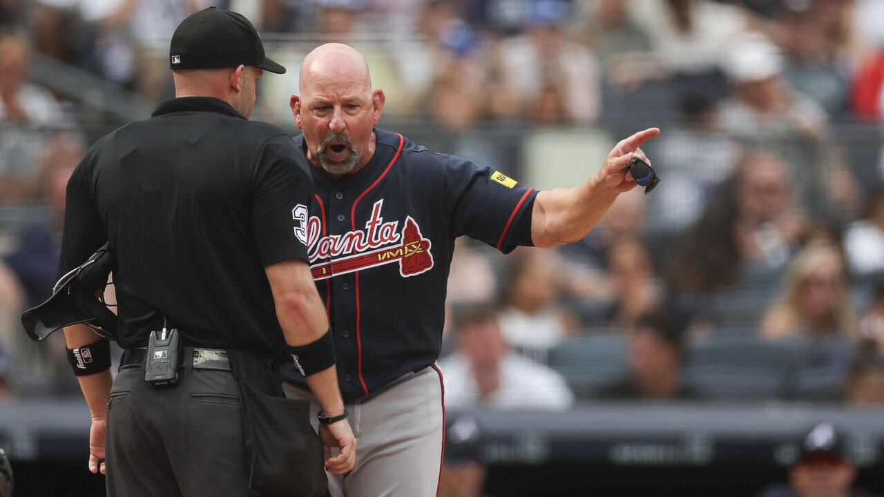NEW YORK, NEW YORK - AUGUST 08: Home plate umpire Dan Merzel #3 talks to manager Walt Weiss #22 of the Atlanta Braves after a balk call during the fifth inning against the New York Yankees at Yankee Stadium on August 08, 2026 in the Bronx borough of New York City.