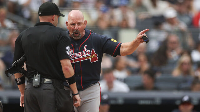 NEW YORK, NEW YORK - AUGUST 08: Home plate umpire Dan Merzel #3 talks to manager Walt Weiss #22 of the Atlanta Braves after a balk call during the fifth inning against the New York Yankees at Yankee Stadium on August 08, 2026 in the Bronx borough of New York City.