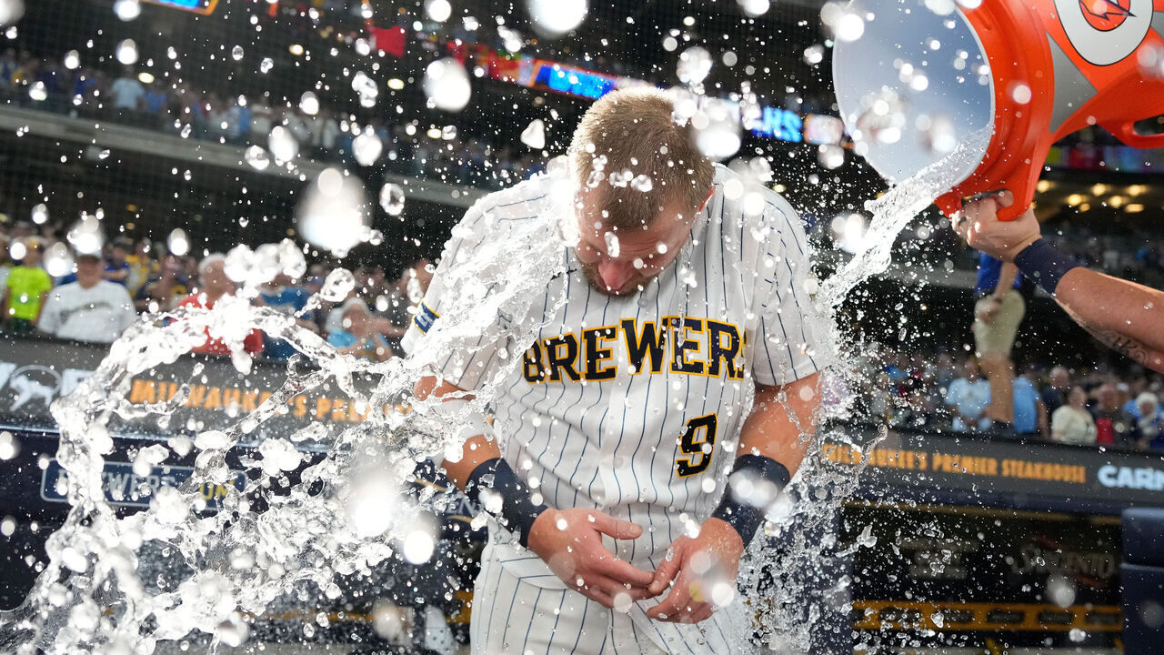 MILWAUKEE, WISCONSIN - AUGUST 09: Jake Bauers #9 of the Milwaukee Brewers gets dunked after hitting a walk-off single in the tenth inning for a 4-3 win over the Minnesota Twins at American Family Field on August 09, 2026 in Milwaukee, Wisconsin.