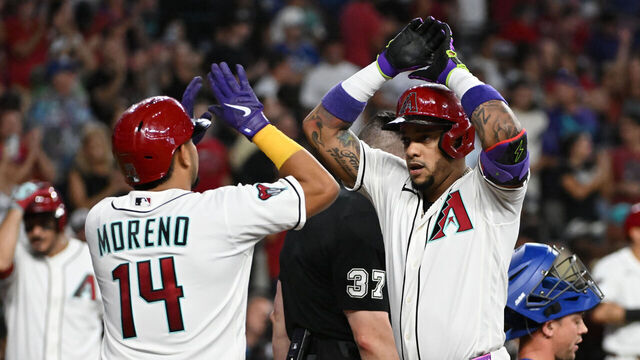 PHOENIX, ARIZONA - AUGUST 09: Ketel Marte #4 of the Arizona Diamondbacks celebrates with Gabriel Moreno #14 after hitting a two run home run against the Los Angeles Dodgers during the first inning at Chase Field on August 09, 2026 in Phoenix, Arizona.