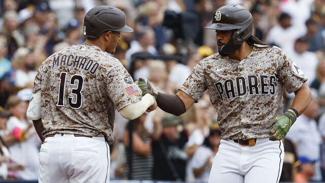 SAN DIEGO, CALIFORNIA - AUGUST 9: Manny Machado #13 and Fernando Tatis Jr. #23 of the San Diego Padres celebrate after Tatis' three-run home run against the Houston Astros during the fourth inning at Petco Park on August 9, 2026 in San Diego, California.