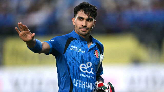 Afghanistan's Rahmanullah Gurbaz gestures as he walks back to the pavilion after his dismissal during the first one-day international (ODI) cricket match between India and Afghanistan at the Himachal Pradesh Cricket Association Stadium in Dharamsala on June 13, 2026. / -- IMAGE RESTRICTED TO EDITORIAL USE - STRICTLY NO COMMERCIAL USE --