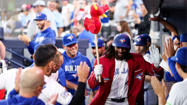 TORONTO, ON - AUGUST 10: Charles McAdoo #26 of the Toronto Blue Jays celebrates with teammates in the dugout after hitting a solo home run in the fifth inning during the game between the Boston Red Sox and the Toronto Blue Jays at Rogers Centre on Monday, August 10, 2026 in Toronto, Ontario, Canada.