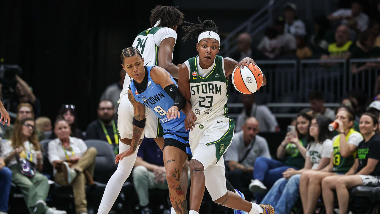 SEATTLE, WASHINGTON - AUGUST 10: Jordan Horston #23 of the Seattle Storm brings the ball up court on screen from teammate Dominique Malonga #14 on Natasha Cloud #9 of the Chicago Sky during the third quarter at Climate Pledge Arena on August 10, 2026 in Seattle, Washington.