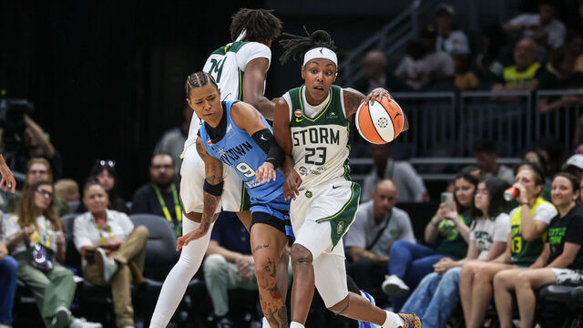 SEATTLE, WASHINGTON - AUGUST 10: Jordan Horston #23 of the Seattle Storm brings the ball up court on screen from teammate Dominique Malonga #14 on Natasha Cloud #9 of the Chicago Sky during the third quarter at Climate Pledge Arena on August 10, 2026 in Seattle, Washington.