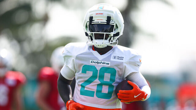 MIAMI GARDENS, FLORIDA - AUGUST 04: De'von Achane #28 of the Miami Dolphins carries the ball during training camp practice at Baptist Health Training Complex on August 04, 2026 in Miami Gardens, Florida.