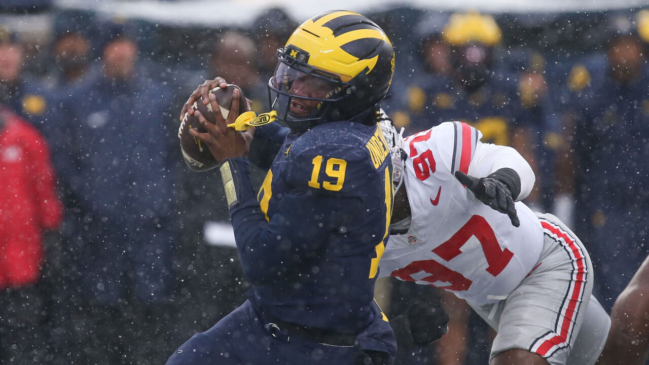 ANN ARBOR, MI - NOVEMBER 29: Michigan Wolverines quarterback Bryce Underwood (19) tries to avoid being tackled by Ohio State Buckeyes defensive end Kenyatta Jackson Jr. (97) during the fourth quarter of a regular season Big Ten Conference college football game between the Ohio State Buckeyes and the Michigan Wolverines on November 29, 2025 at Michigan Stadium in Ann Arbor, Michigan.