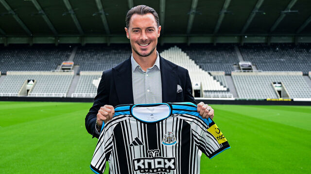 NEWCASTLE UPON TYNE, ENGLAND - AUGUST 11: Matthias Jaissle holds a Newcastle Home Shirt on the pitch of St.James' Park as he is unveiled as the new Newcastle United Head Coach at St James' Park on August 11, 2026 in Newcastle upon Tyne, England.