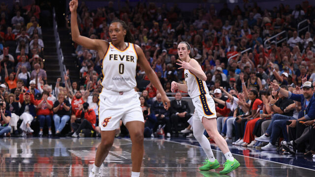 INDIANAPOLIS, INDIANA - AUGUST 11: Kelsey Mitchell #0 and Caitlin Clark #22 of the Indiana Fever react after a three point shot against the New York Liberty during the first half at Gainbridge Fieldhouse on August 11, 2026 in Indianapolis, Indiana.