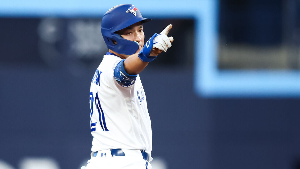TORONTO, CANADA - AUGUST 11: Brett Bateman #21 of the Toronto Blue Jays reacts on second base after hitting an RBI-double to score in Nathan Lukes #38 (not pictured) in the third inning of their MLB game against the Boston Red Sox at Rogers Centre on August 11, 2026 in Toronto, Canada.