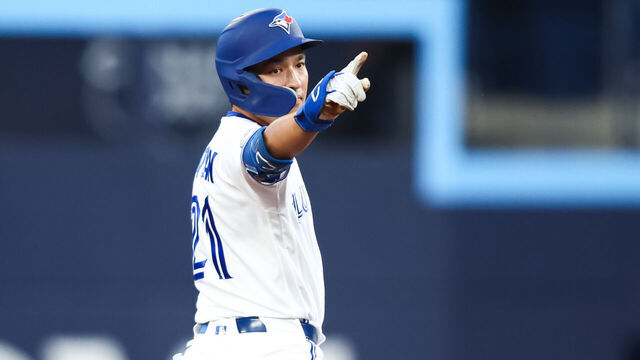 TORONTO, CANADA - AUGUST 11: Brett Bateman #21 of the Toronto Blue Jays reacts on second base after hitting an RBI-double to score in Nathan Lukes #38 (not pictured) in the third inning of their MLB game against the Boston Red Sox at Rogers Centre on August 11, 2026 in Toronto, Canada.