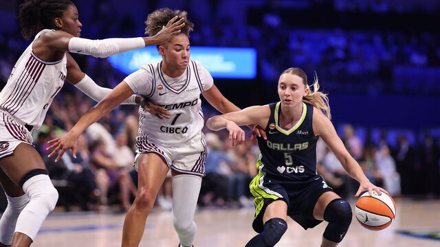 ARLINGTON, TEXAS - AUGUST 12: Paige Bueckers #5 of the Dallas Wings is defended by Kiki Rice #1 and Temi Fágbénlé #14 of the Toronto Tempo during the third quarter at College Park Center on August 12, 2026 in Arlington, Texas.