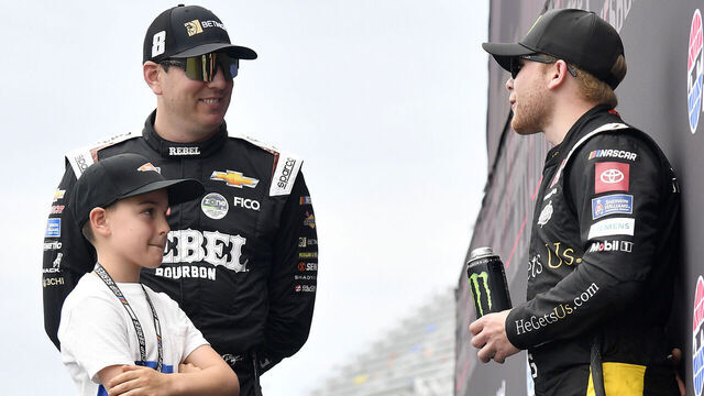CONCORD, NORTH CAROLINA - MAY 25: Kyle Busch, driver of the #33 BetMGM/Rebel Bourbon Chevrolet, (L) and son, Brexton Busch speak to Ty Gibbs, driver of the #20 He Gets Us Toyota, backstage during pre-race ceremonies prior to the NASCAR Xfinity Series BetMGM 300 at Charlotte Motor Speedway on May 25, 2024 in Concord, North Carolina.
