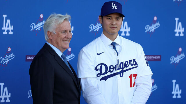 LOS ANGELES, CA - DECEMBER 14: Newly acquired Los Angeles Dodgers two-way player Shohei Ohtani (17) and the Los Angeles Dodgers owner Mark Walter (left) pose for a photo at the introductory press conference on December 14, 2023 at Dodger Stadium in Los Angeles, CA.