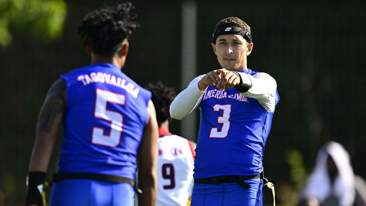 American Samoa's Tai Natani-Othoniel Tiedemann (R) and Taulia Tagovailoa celebrate during the men's match between American Samoa and the US at the "IFAF World Flag" World Championship in flag football in Duesseldorf, western Germany, on August 14, 2026.