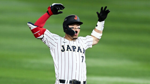 MIAMI, FLORIDA - MARCH 14: Teruaki Sato #7 of Team Japan hits a RBI double in the third inning during the game between Venezuela and Japan at loanDepot park on March 14, 2026 in Miami, Florida.