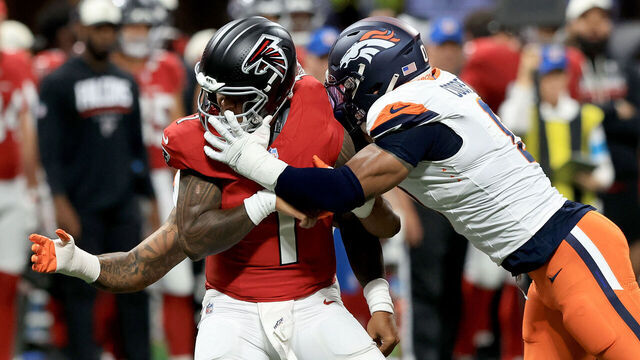 ATLANTA, GA - AUGUST 14: Jonathon Cooper (0) of the Denver Broncos pressures Tua Tagovailoa (1) of the Atlanta Falcons during the Friday evening NFL preseason football game between the Atlanta Falcons and the Denver Broncos on August 14, 2026 at Mercedes-Benz Stadium in Atlanta, Georgia.