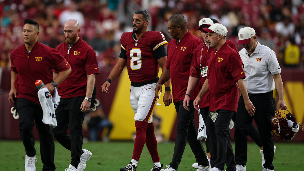 LANDOVER, MD - AUGUST 14: Marcus Mariota #8 of the Washington Commanders walks off the field after being injured during the first half of the preseason game against the Miami Dolphins at Northwest Stadium on August 14, 2026 in Landover, Maryland.