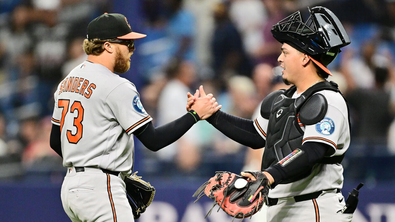 ST PETERSBURG, FLORIDA - AUGUST 14: Cam Sanders #73 of the Baltimore Orioles celebrates with Yohel Pozo #79 after defeating the Tampa Bay Rays 6-5 at Tropicana Field on August 14, 2026 in St Petersburg, Florida.