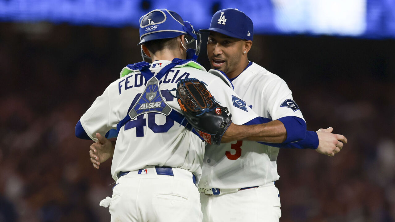 LOS ANGELES, CA - AUGUST 14: Edwin Díaz #3 of the Los Angeles Dodgers hugs Hunter Feduccia #46 after defeating the Milwaukee Brewers at UNIQLO Field at Dodger Stadium on Friday, August 14, 2026 in Los Angeles, California.