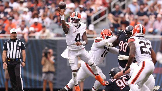 CHICAGO, ILLINOIS - AUGUST 15: Deshaun Watson #4 of the Cleveland Browns scrambles out of the pocket and throws downfield during the second quarter of a preseason game against the Chicago Bears at Soldier Field on August 15, 2026 in Chicago, Illinois.