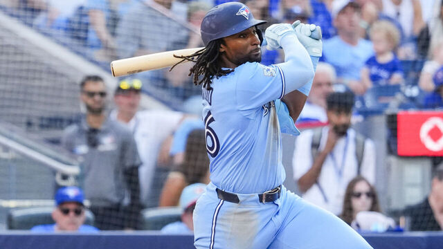 TORONTO, CANADA - AUGUST 15: Charles McAdoo #26 of the Toronto Blue Jays hits an RBI single against the New York Yankees during the eighth inning of an MLB game at the Rogers Centre on August 15, 2026 in Toronto, Ontario, Canada.
