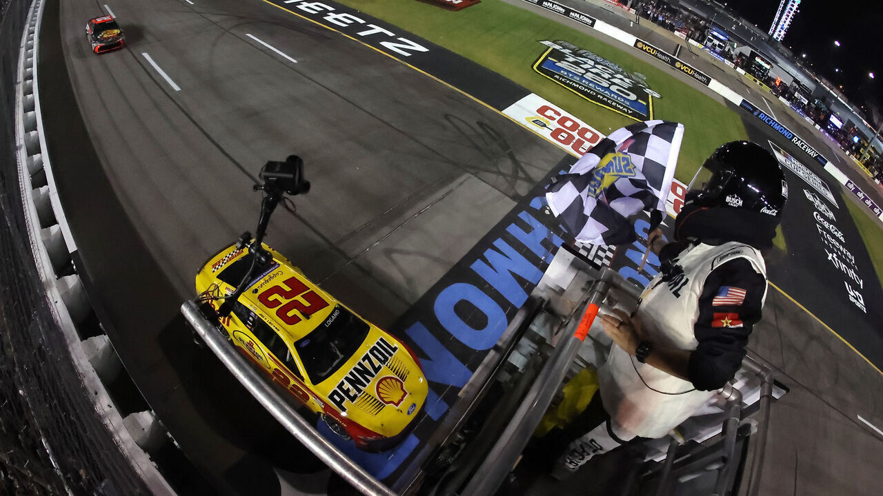 RICHMOND, VIRGINIA - AUGUST 15: Joey Logano, driver of the #22 Shell Pennzoil Ford, takes the checkered flag to win the NASCAR Cup Series Cook Out 400 at Richmond Raceway on August 15, 2026 in Richmond, Virginia.