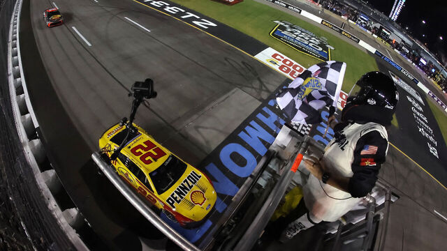 RICHMOND, VIRGINIA - AUGUST 15: Joey Logano, driver of the #22 Shell Pennzoil Ford, takes the checkered flag to win the NASCAR Cup Series Cook Out 400 at Richmond Raceway on August 15, 2026 in Richmond, Virginia.