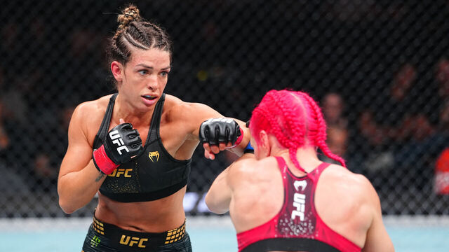 PHILADELPHIA, PENNSYLVANIA - AUGUST 15: (L-R) Mackenzie Dern punches Gillian Robertson of Canada in the UFC strawweight championship fight during the UFC 330 event at Xfinity Mobile Arena on August 15, 2026 in Philadelphia, Pennsylvania.