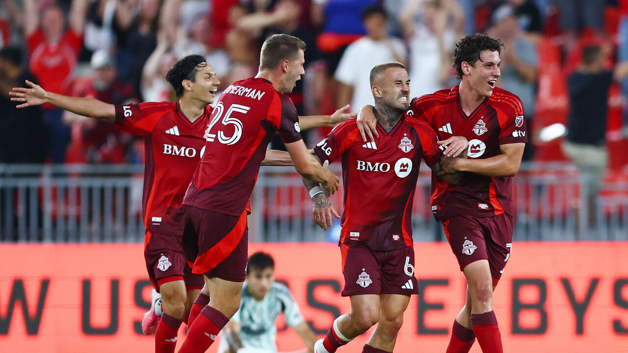 TORONTO, ON - AUGUST 15: Niklas Dorsch #6 of Toronto FC celebrates a goal with teammates during the first half of a game against New England Revolution at BMO Field on August 15, 2026 in Toronto, Ontario, Canada.