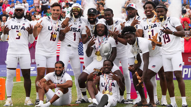 DUESSELDORF, GERMANY - AUGUST 16: United States players pose for a photograph with the trophy after team's victory in the Final match between Italy and United States on day four of the IFAF World Flag Düsseldorf 2026 at Flag Football Komplex Bezirkssportanlage on August 16, 2026 in Duesseldorf, Germany. At the IFAF World Flag 26, 16 women's and 16 men's teams from 19 nations across five continents will be competing for the world title and one of the two coveted places at LA28 Olympic Summer Games.