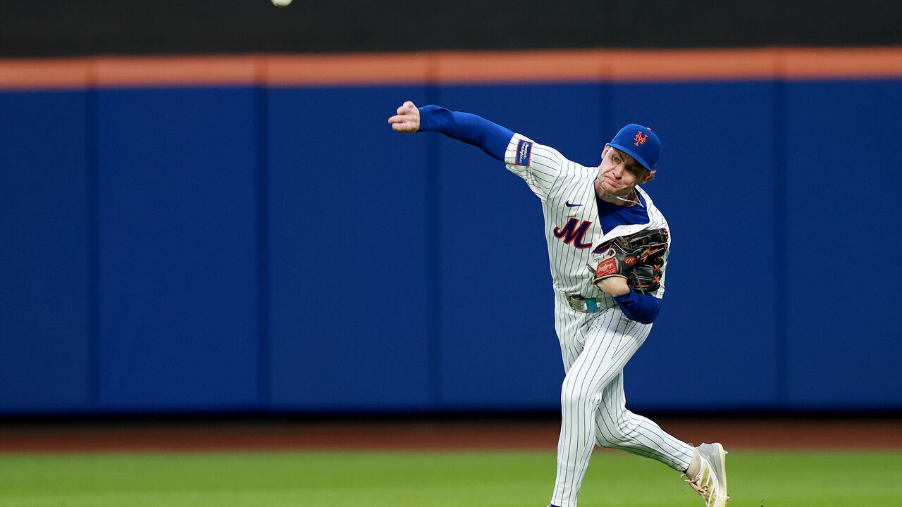 NEW YORK, NEW YORK - AUGUST 17: Carson Benge #3 of the New York Mets fields a hit by Jackson Merrill of the San Diego Padres and sends it home to Francisco Alvarez #4 of the New York Mets and Manny Machado is tagged out to end the first inning at Citi Field on August 17, 2026 in the Flushing neighborhood of the Queens borough of New York City.